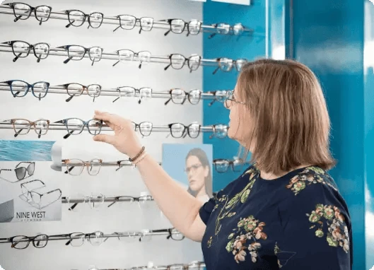A patient choosing frames from the display wall