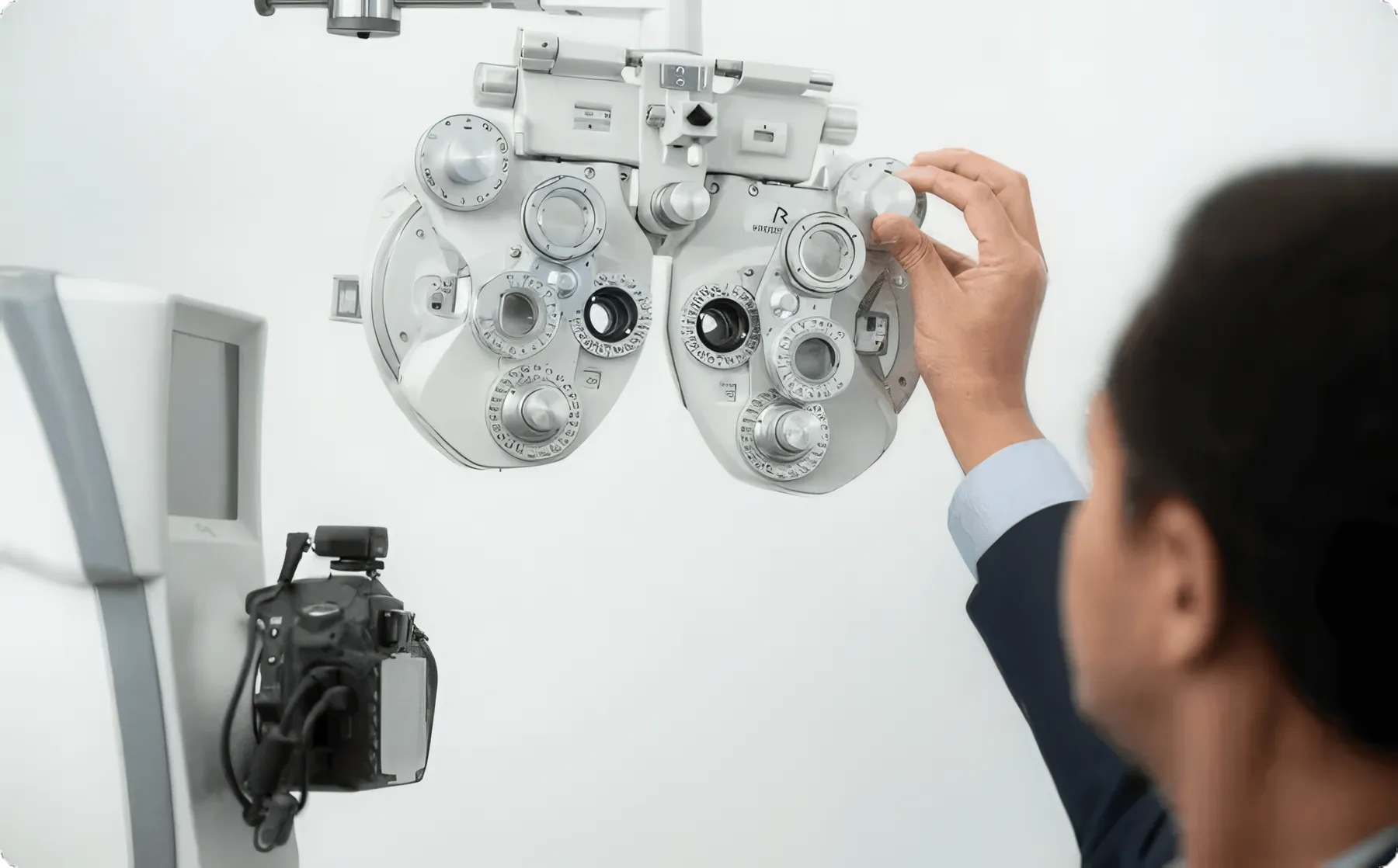 An optometrist setting up the phoropter for an eye test